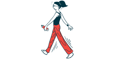 A woman is walking while holding a water bottle.