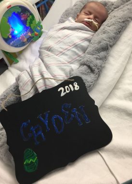 missing holidays | Pompe Disease News | Baby Cayden sleeps in a hospital bed on Easter in 2018.