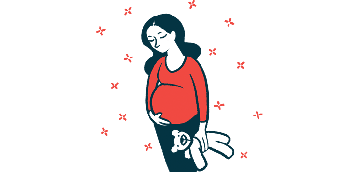 A pregnant woman stands holding a plush toy and rubs her belly.