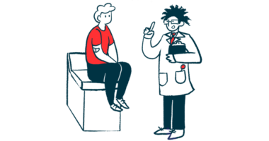 A medical professional holding a clipboard gestures while talking with a patient seated on an examining table.