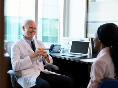 A doctor consulting with a female patient