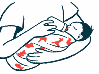 A baby is being held while drinking from a bottle.