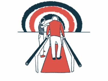 A therapist guides a patient as he walks between two rails