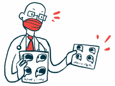 A doctor wearing a face mask speaks as he holds a pair of charts.