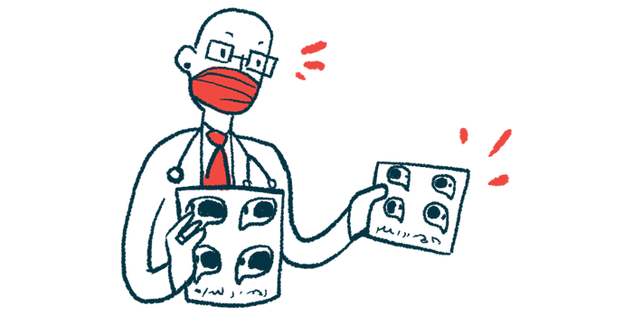 A doctor wearing a face mask speaks as he holds a pair of charts.