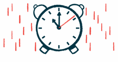 An analog alarm clock indicating 11 o'clock.